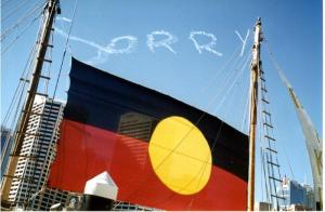 Image of aboriginal flag with sorry in the background