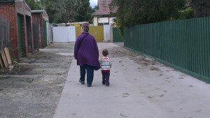 My son and my mother walking together.
